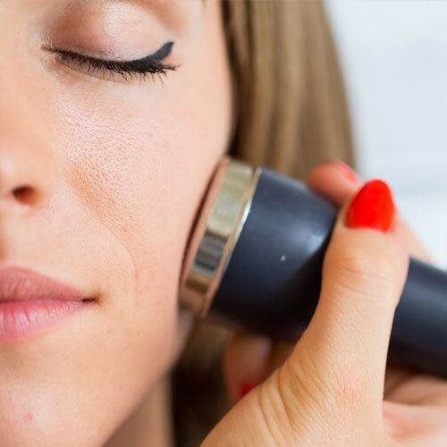 Woman doing microdermabrasion procedure - aesthetic & wellness in Placentia, CA Woman doing microdermabrasion procedure - aesthetic & wellness in Placentia, CA