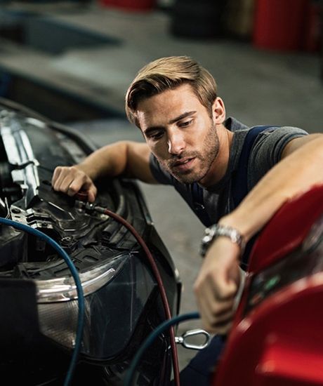 Mechanic Checking Vehicle — Norwalk, CA — Troy & Bobs Auto Works Mechanic Checking Vehicle — Norwalk, CA — Troy & Bobs Auto Works