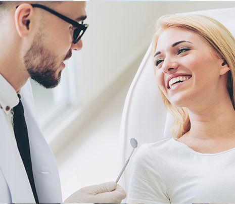 Gum Treatment — Dentist Talking with Patient in Brownsburg, IN Gum Treatment — Dentist Talking with Patient in Brownsburg, IN