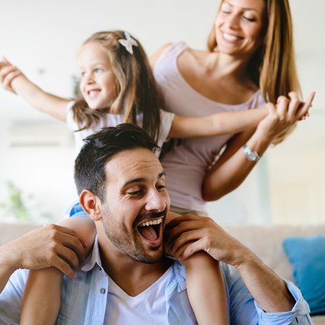Affordable Dentist — Happy Family Having Fun Times at Home in Brownsburg, IN Affordable Dentist — Happy Family Having Fun Times at Home in Brownsburg, IN