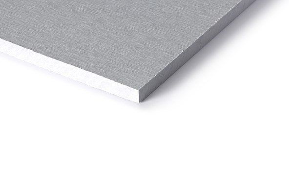 Silver-colored aluminum composite material sheet with a white core, angled against a white background.