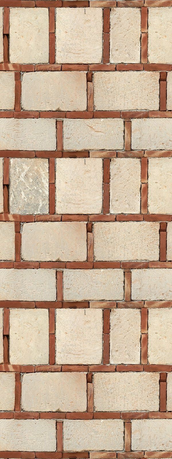 Brick wall with beige blocks and red mortar.
