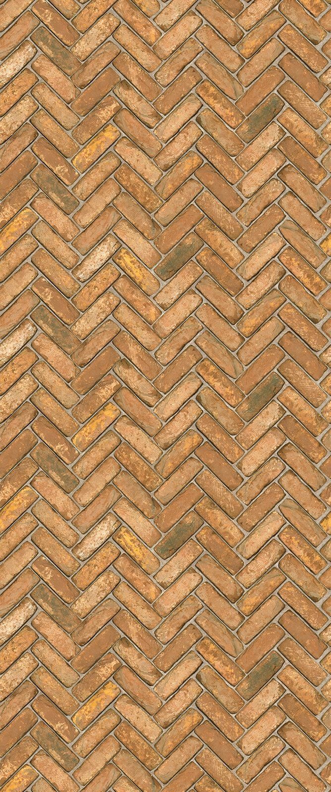 Herringbone pattern of brown bricks.