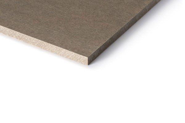 Close-up of a brown, square-shaped building material against a white background; shows the edge and top.