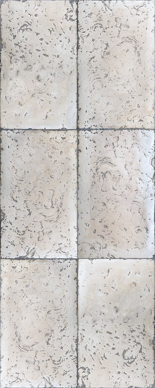Six beige stone tiles arranged in a vertical pattern, with dark speckles and gray grout lines.