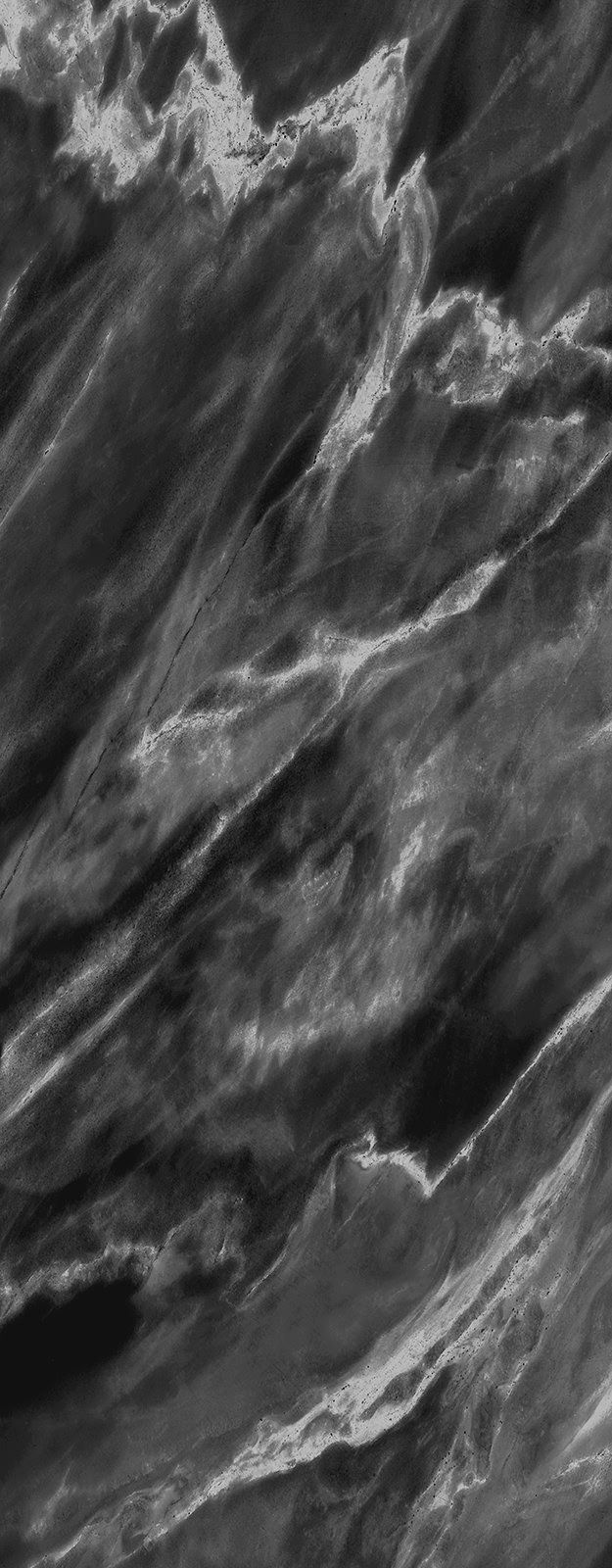 Black and white close-up of marble with diagonal veining.