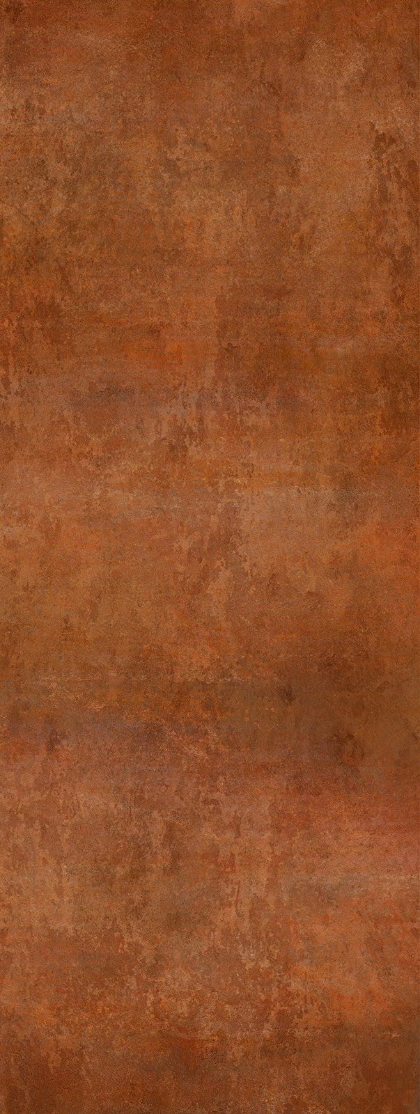 A textured, brown surface with variations in color resembling rusted metal.