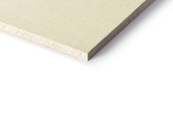 Beige rectangular building material corner against white.
