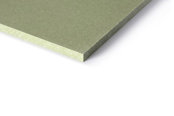 Green cement board, close-up corner view, angled on white background.