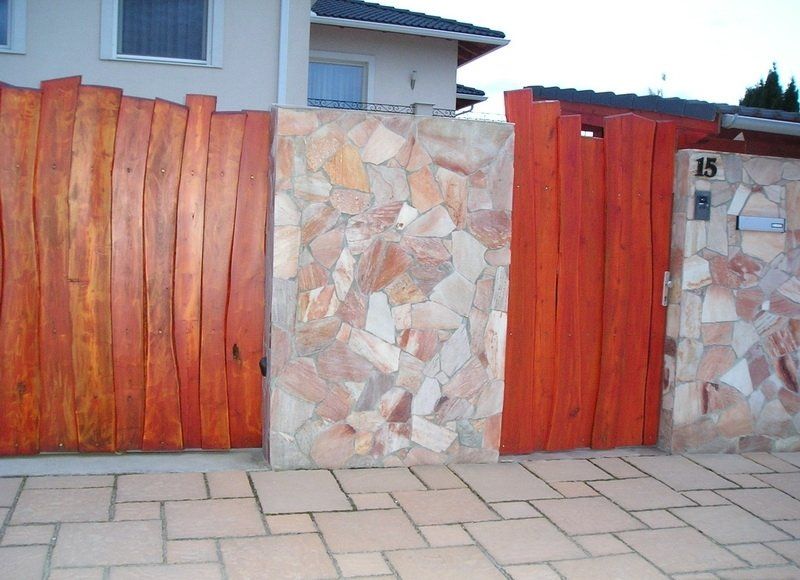 Fence sections: wood planks, stone tiles, house number 15.