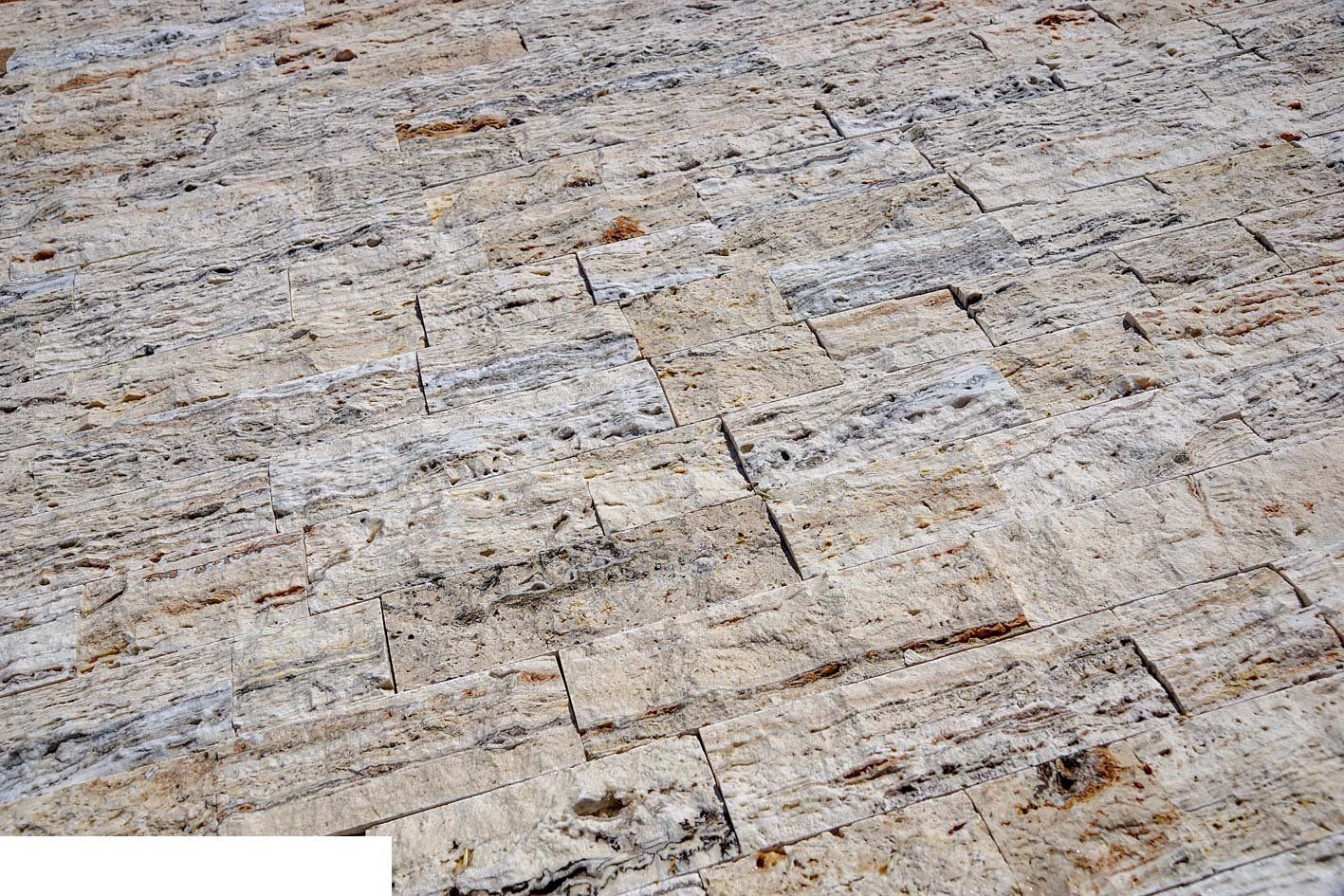 Tan, white, and gray rectangular stone tile floor.