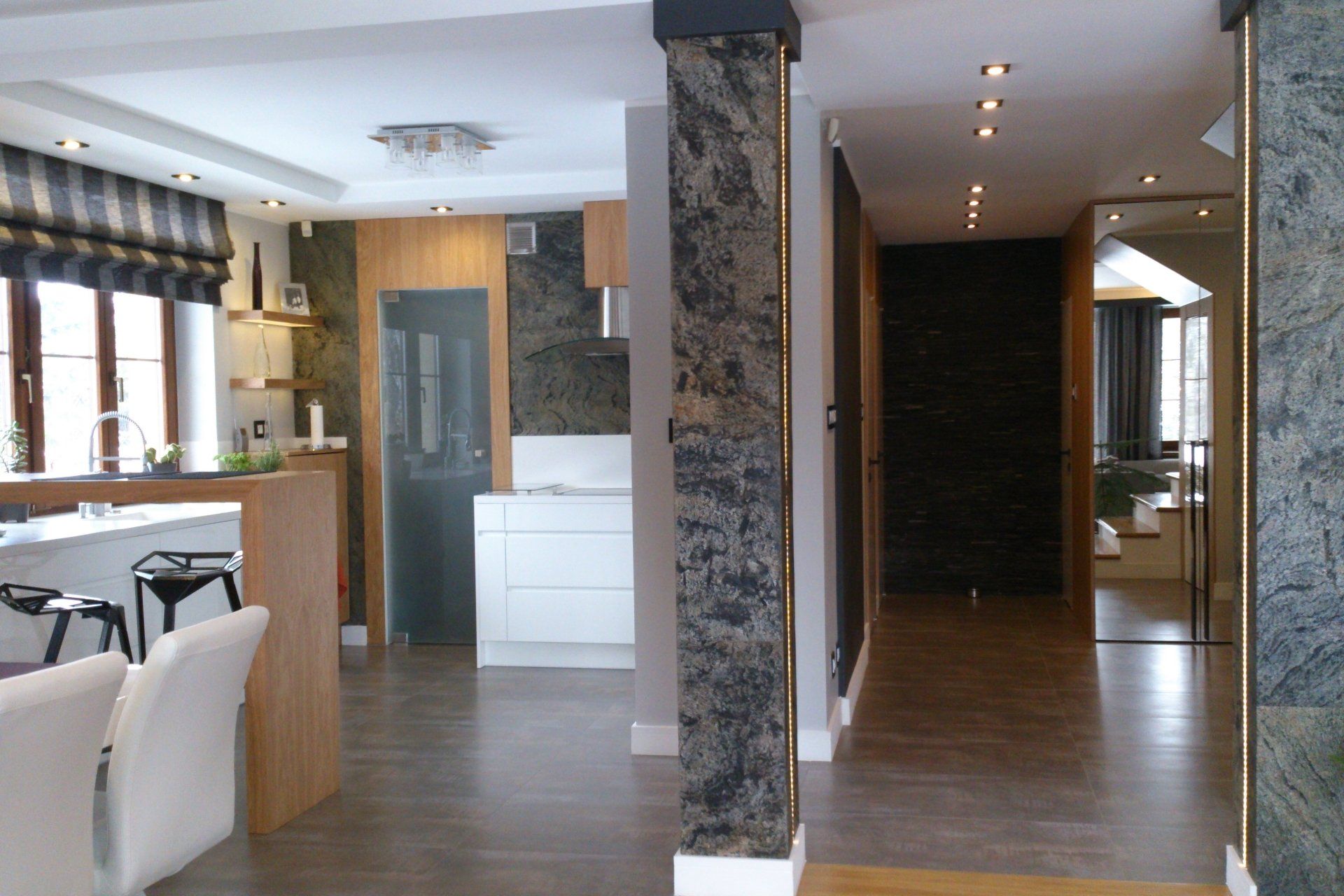 Modern home interior with wood and marble elements.