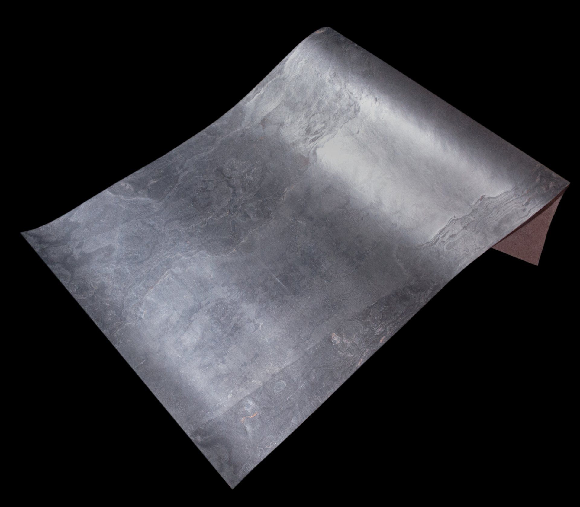 Silver-colored sheet material, slightly curled, on a black background.