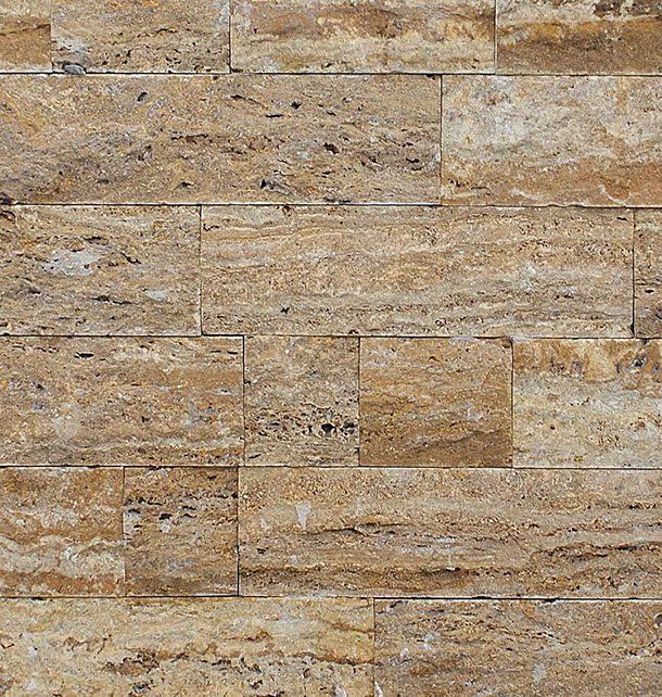 Beige and tan stone tile wall with horizontal rectangular pieces.