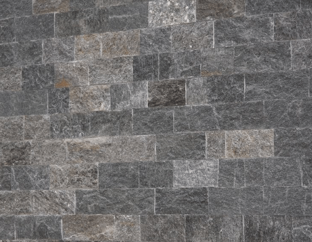 Gray stone brick wall with varying shades and textures.