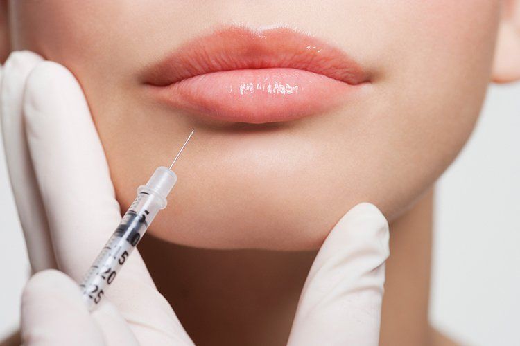 Receiving Botox Injection in Lips — Liberty, MO — Triplett Dental Receiving Botox Injection in Lips — Liberty, MO — Triplett Dental