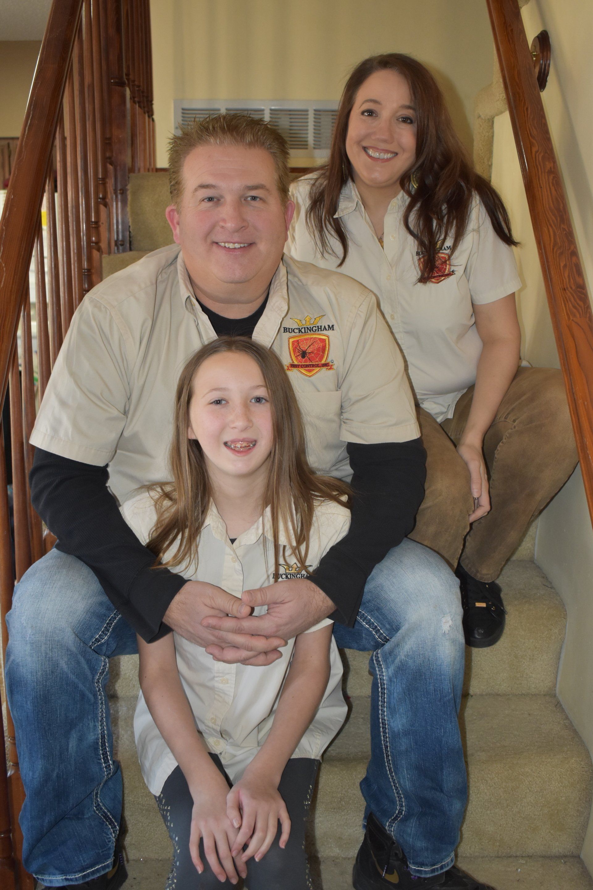 a family posing for a picture on a set of stairs