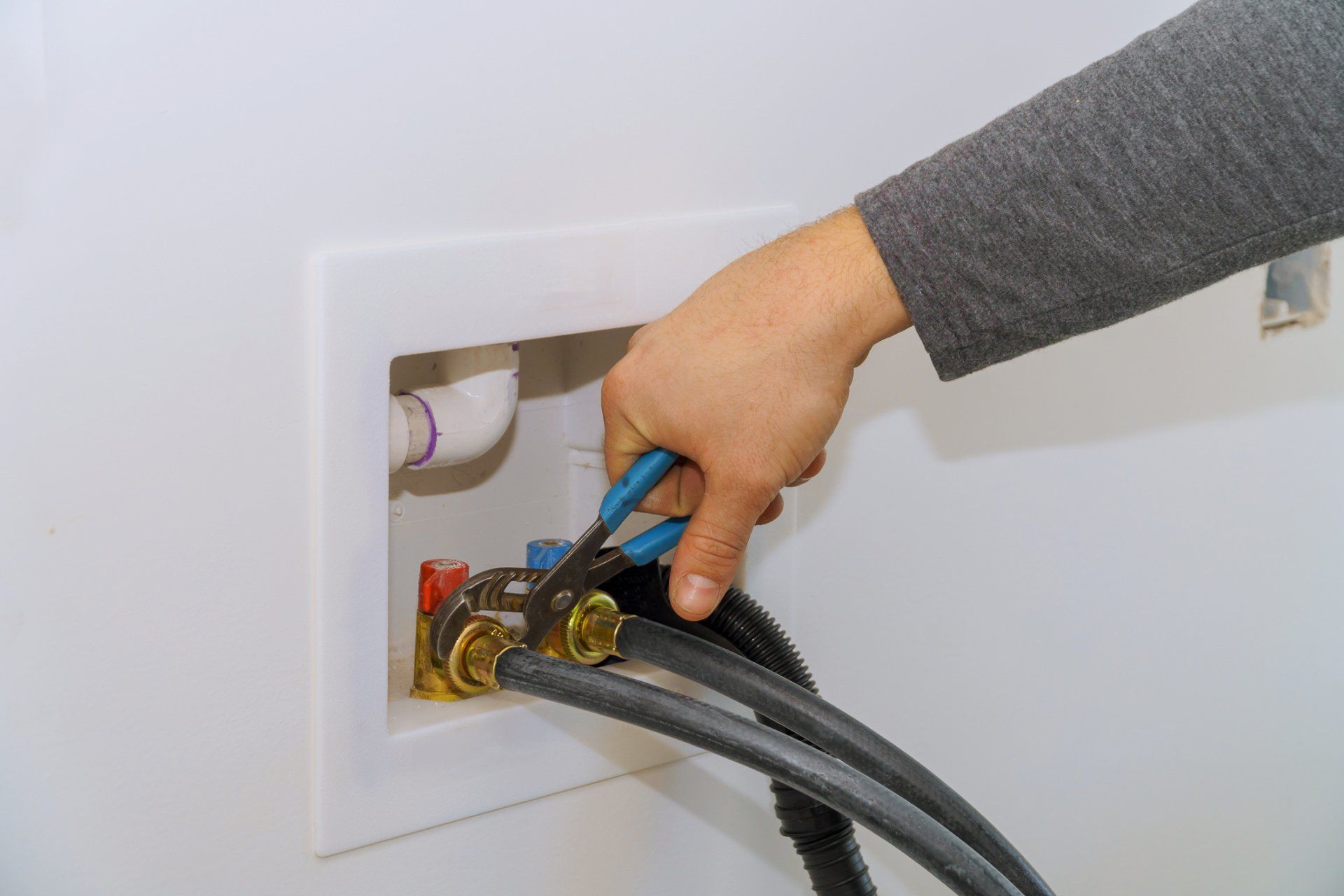 Installing Water Hose on Machine — Winchester, TN — Blankenship Plumbing Co