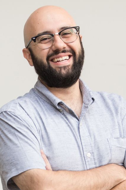 headshot of smiling business owner, Thamer