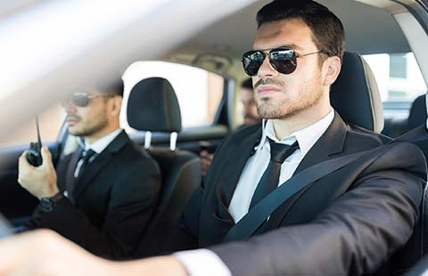 Two Security Guards on a Car | Baltimore, MD | Arrington Security Investigations Two Security Guards on a Car | Baltimore, MD | Arrington Security Investigations