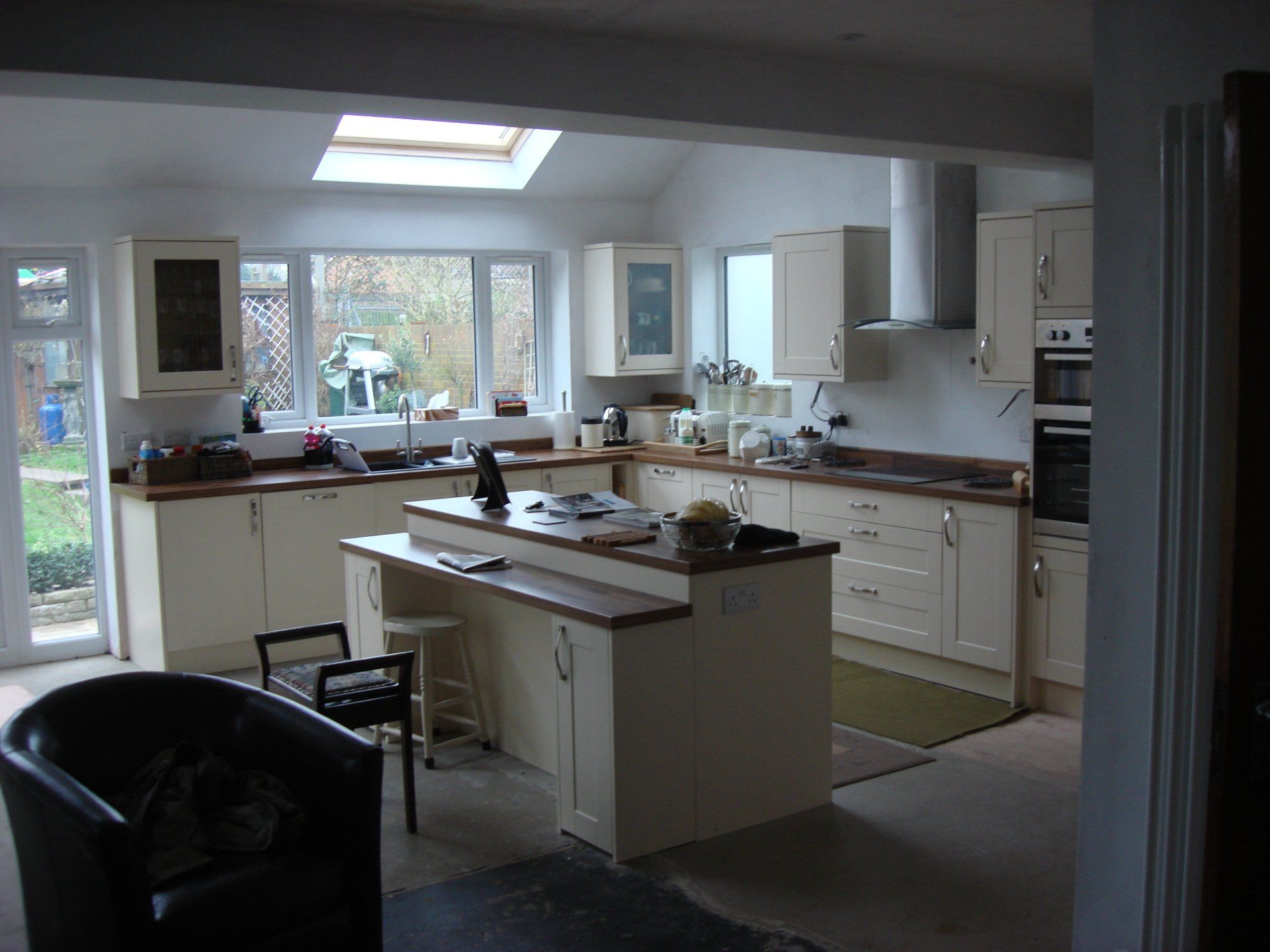 kitchen installed with wooden cabinets and worktops