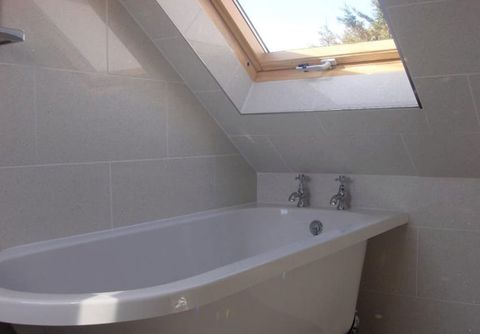 bathroom wall tiling near the bathtub