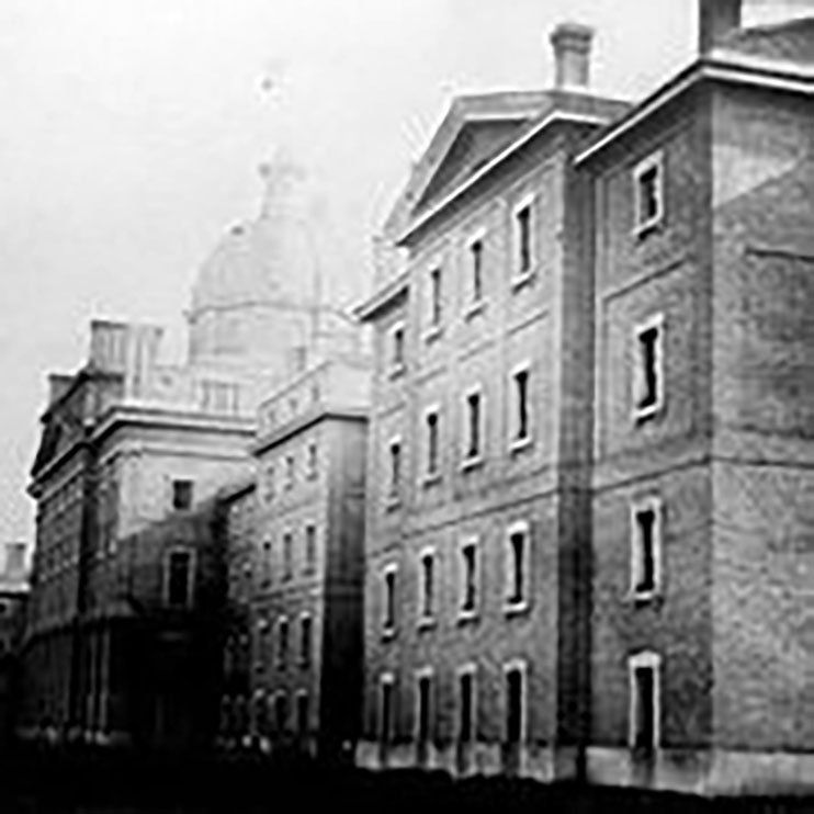 A photograph of the Provincial Asylum at 999 Queen Street West, taken in 1867. The image shows a large four storey building with two wings and a cental ornate dome. The institution that became the Huronia Regional Centre began as a branch of the Provincial Asylum. A photograph of the Provincial Asylum at 999 Queen Street West, taken in 1867. The image shows a large four storey building with two wings and a cental ornate dome. The institution that became the Huronia Regional Centre began as a branch of the Provincial Asylum.