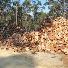 Recycled firewood and landscaping supplies a pile of firewood