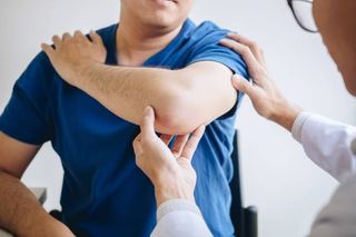 A Man Having By His Shoulder Pain — Santa Maria, CA — Star Physical Therapy Of Santa Maria A Man Having By His Shoulder Pain — Santa Maria, CA — Star Physical Therapy Of Santa Maria