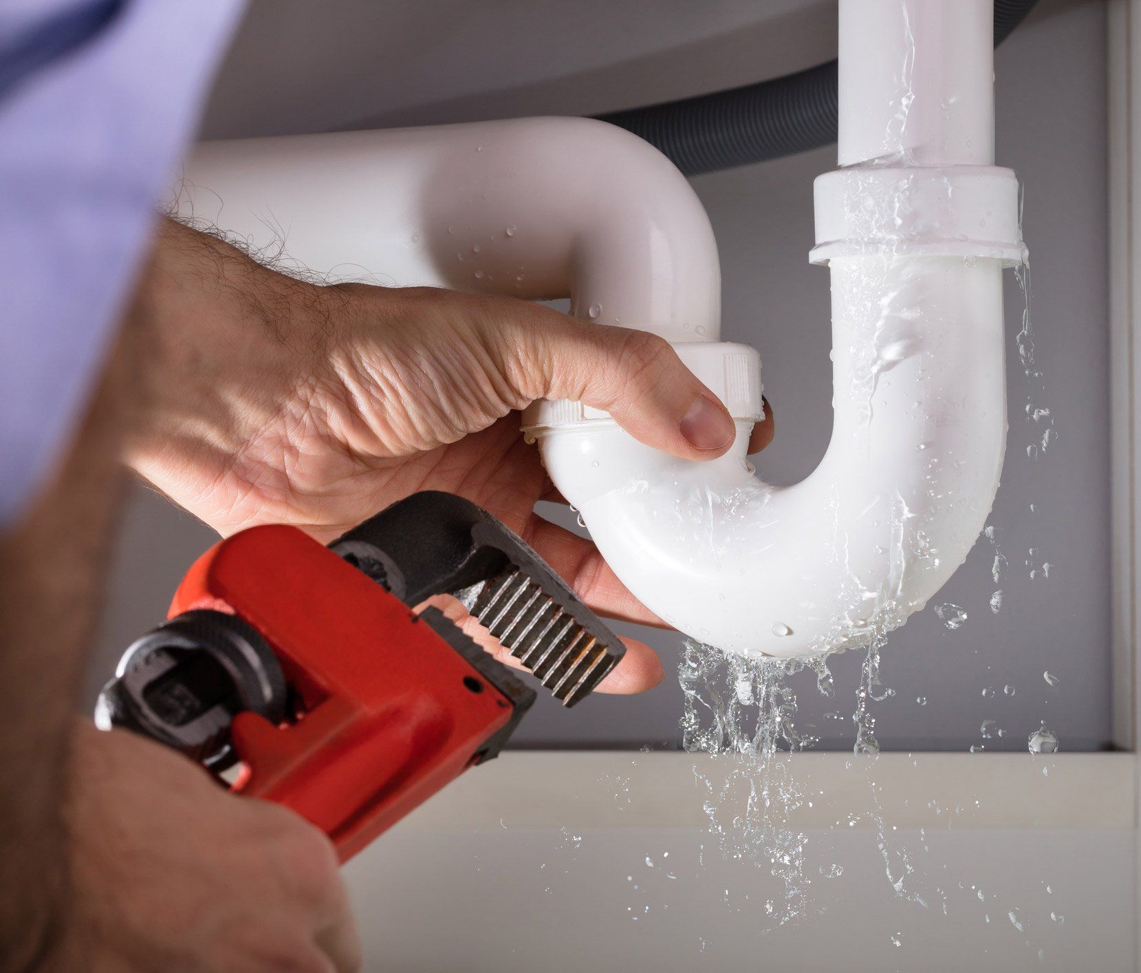 Plumbing — Plumber Fixing Sink Pipe  in Gray, GA