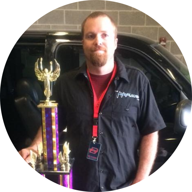 man holding trophy for car audio award