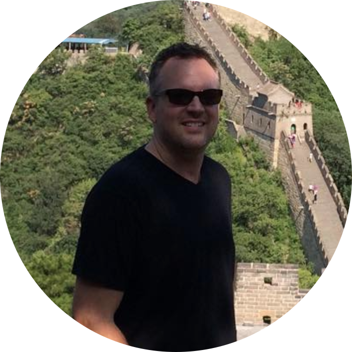 jason milner, man wearing black shirt, standinding on the great wall of china