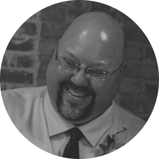 les olga, laughing bald man, face hair, thin glasses, business casual