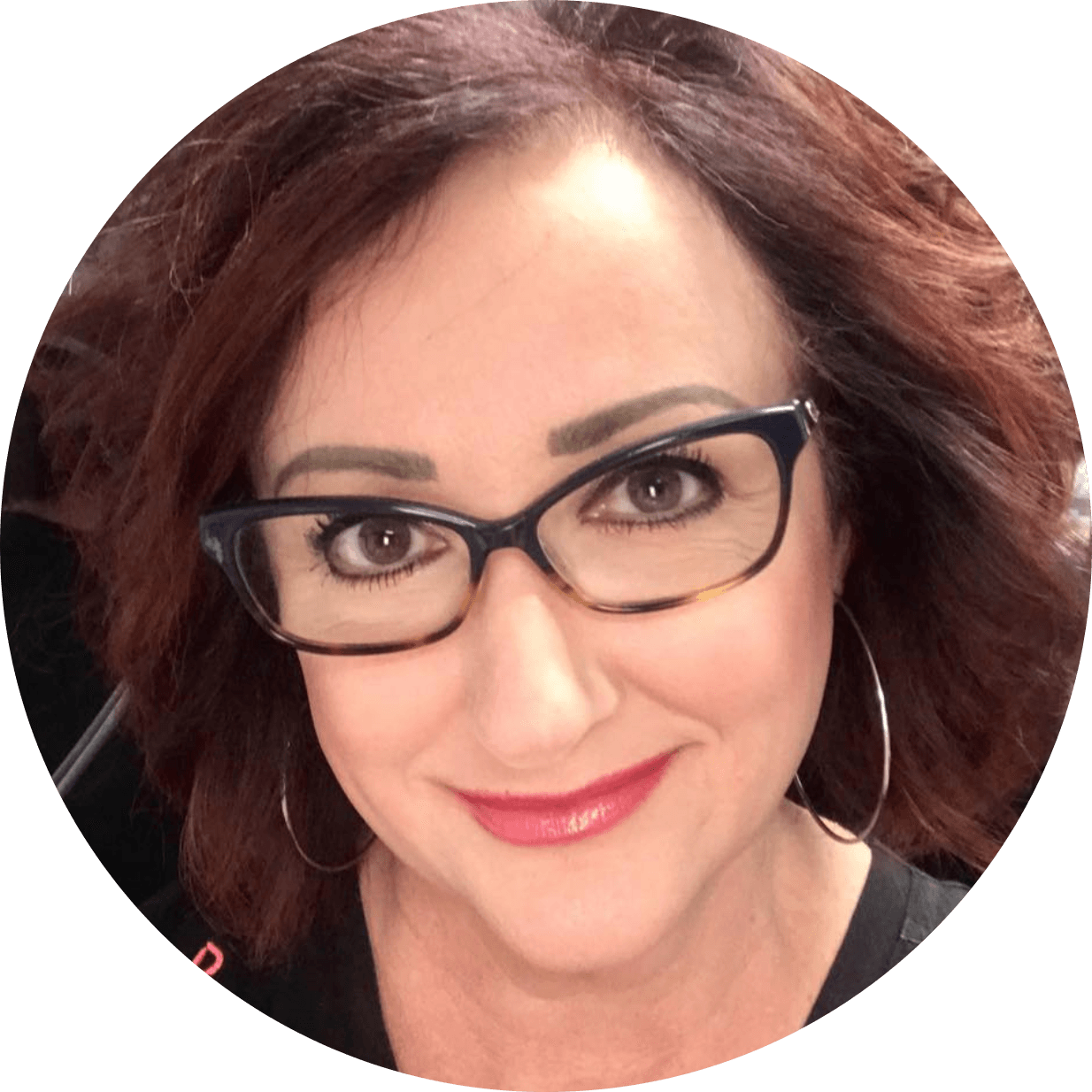 woman wearing cat eye glasses, red hair