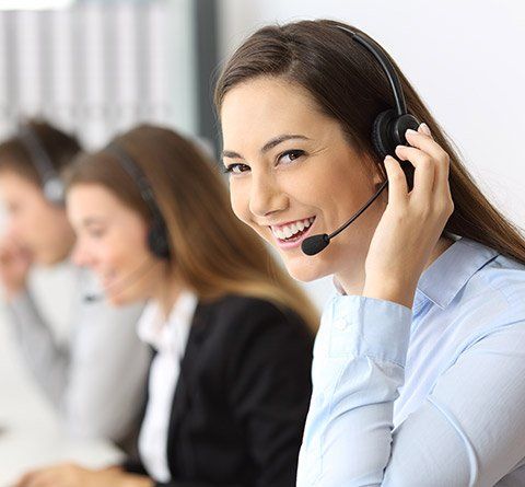 Phone Answering Services — Woman Smiling While On Call in Calabasas, CA Phone Answering Services — Woman Smiling While On Call in Calabasas, CA