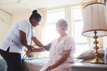 Senior Care — Nurse Checking Blood Pressure of Female Patient in Richmond, VA Senior Care — Nurse Checking Blood Pressure of Female Patient in Richmond, VA