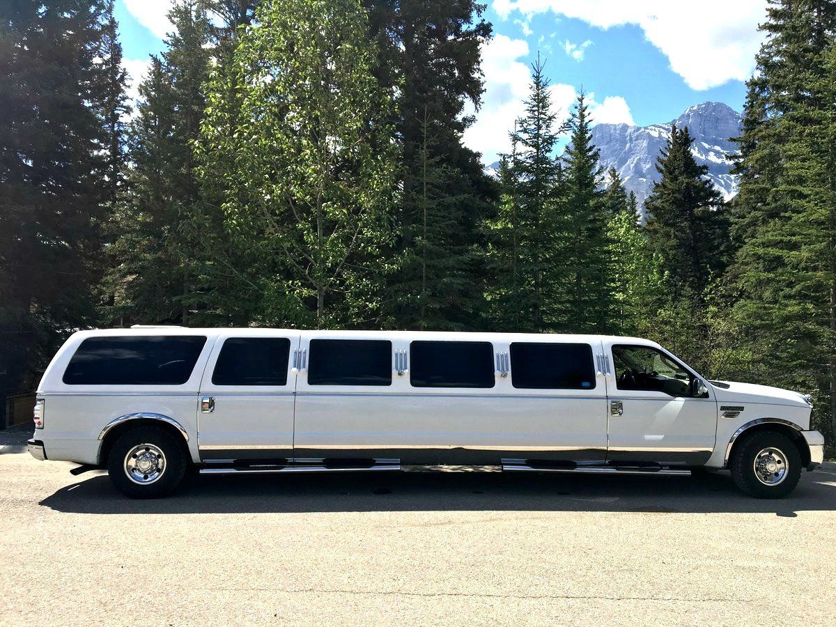 white Limo To Go 14 passenger stretch SUV limousine in Canmore Alberta