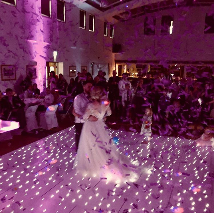 Couple dancing under confetti at Festival Hall