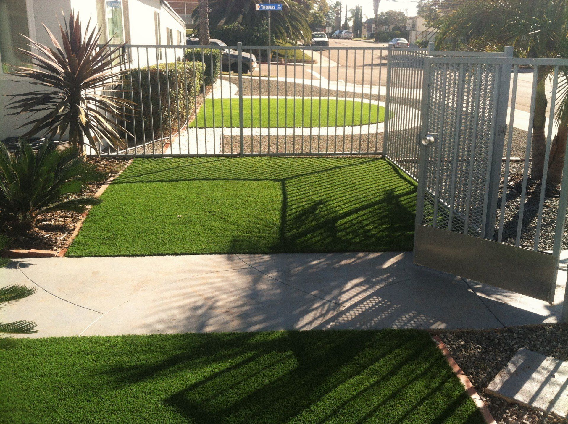river rock outscape artificial turf