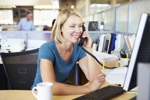 Woman in Office - Rehab Services in Saint John IN