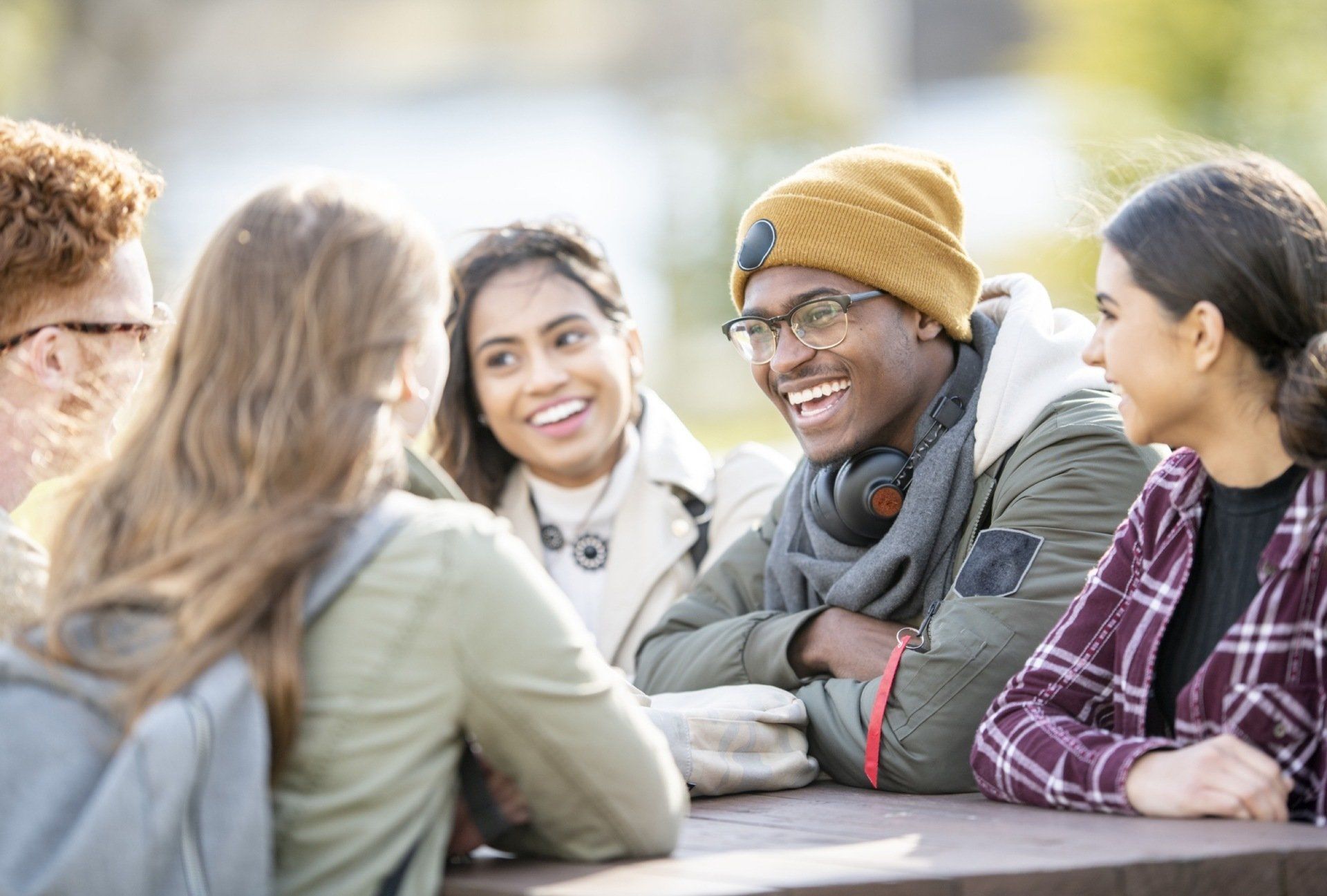 students talking around a table