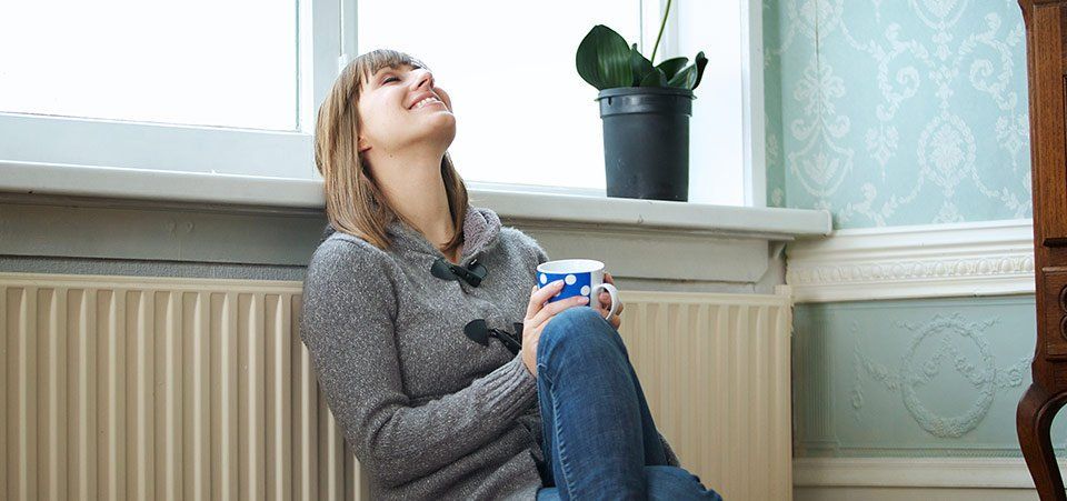 woman relaxing in warm home woman relaxing in warm home