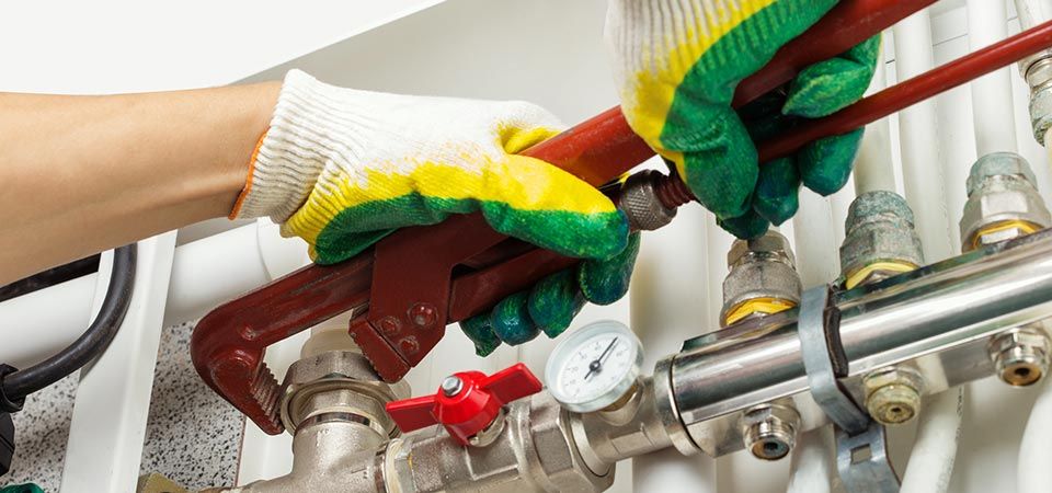 worker hands fixing heating system worker hands fixing heating system