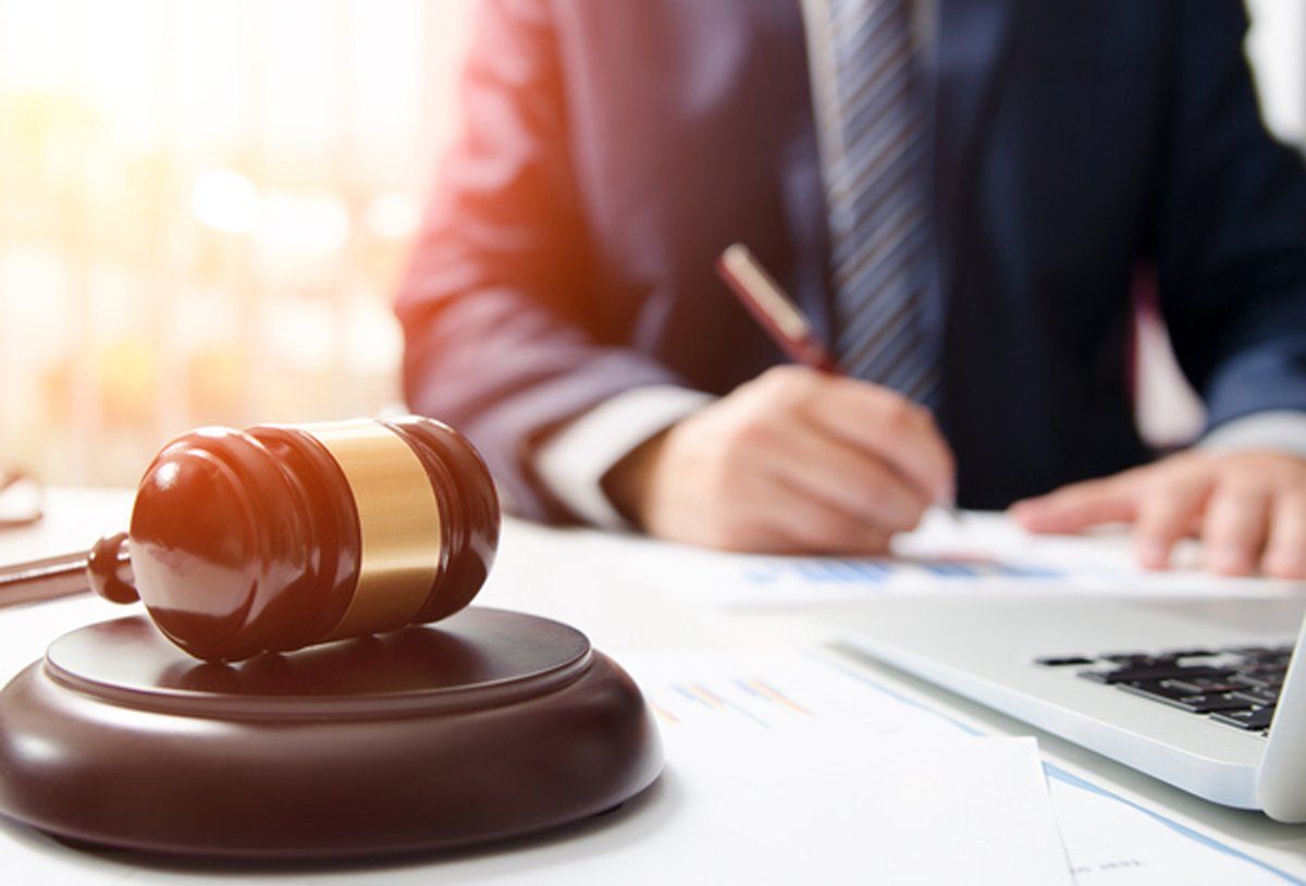 Bankruptcy Claimant — Lawyer Writing with Laptop and Gavel in Marion, MS Bankruptcy Claimant — Lawyer Writing with Laptop and Gavel in Marion, MS