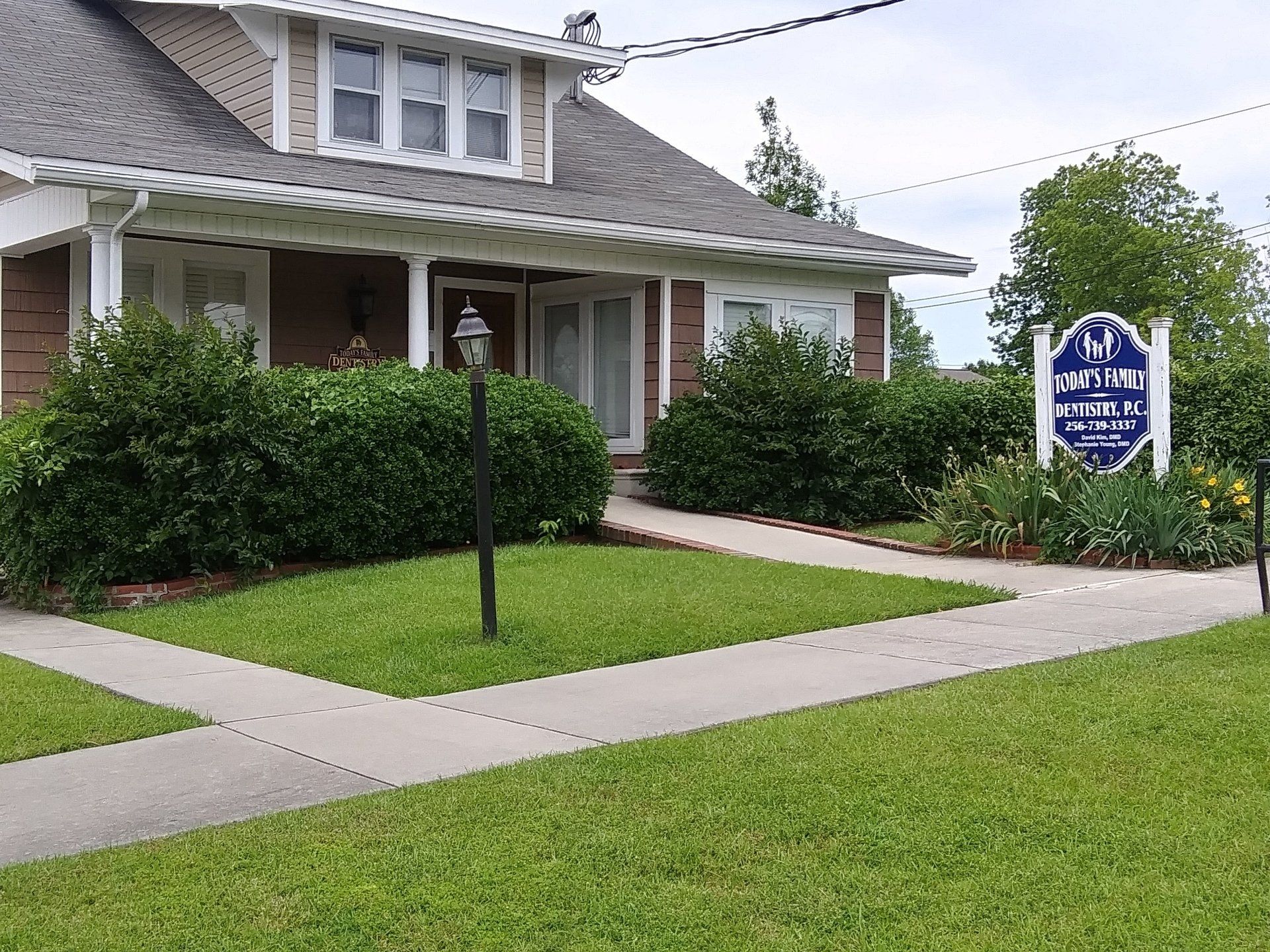 A house with a sign that says ' funeral home ' on it
