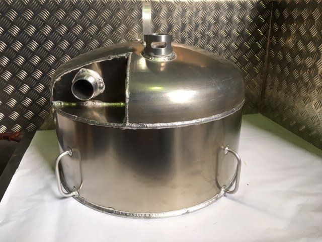 Stainless steel tank with a domed lid and side spout on a checkered metal surface