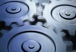 A close up of three gears on a blue background.