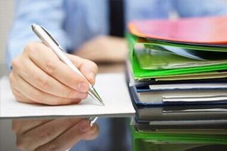 Man Preparing for Bookkeeping — S & S Tax And Financial Services, Inc. in Linden, NJ Man Preparing for Bookkeeping — S & S Tax And Financial Services, Inc. in Linden, NJ