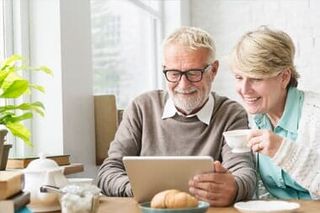 Senior Couple Enjoying their Retirement Years — S & S Tax And Financial Services, Inc. in Linden, NJ Senior Couple Enjoying their Retirement Years — S & S Tax And Financial Services, Inc. in Linden, NJ