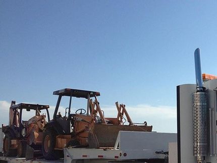 Backhoe at the Truck — Equipment Parts in Fort Worth, TX Backhoe at the Truck — Equipment Parts in Fort Worth, TX